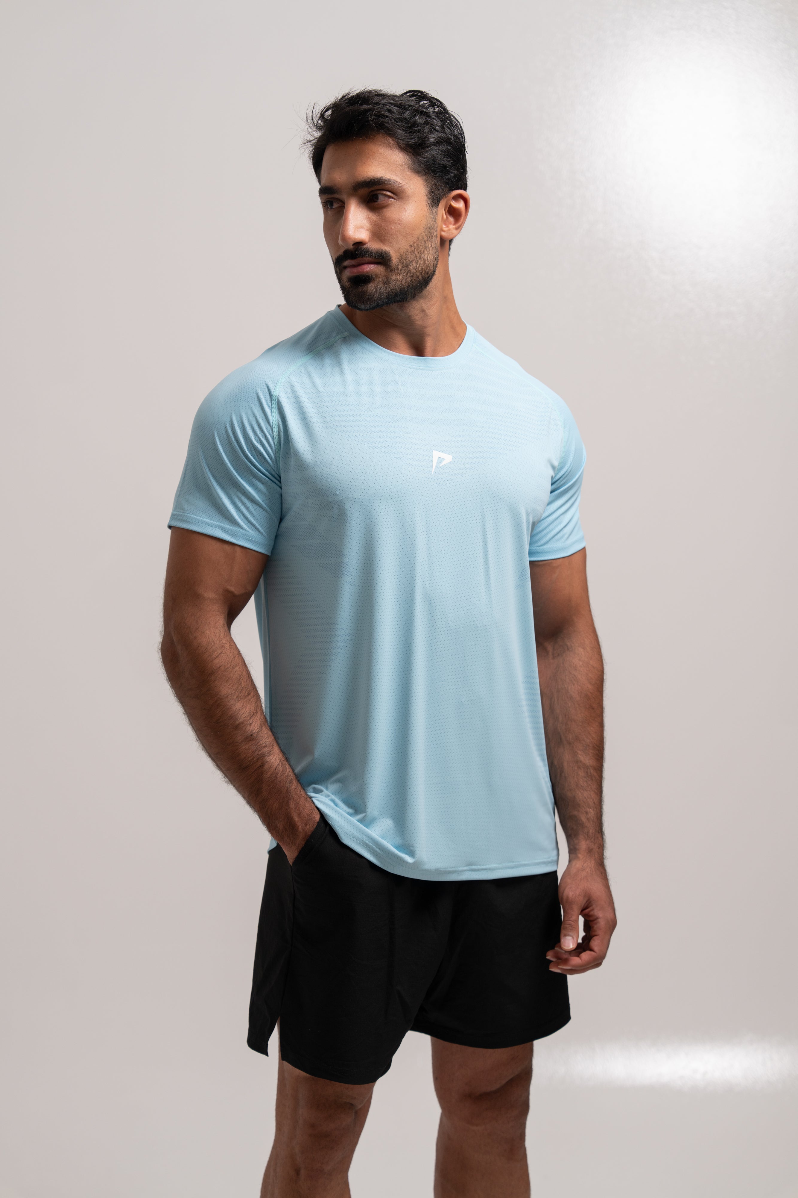 Man wearing PeakForm Archive Pace Tee, front view